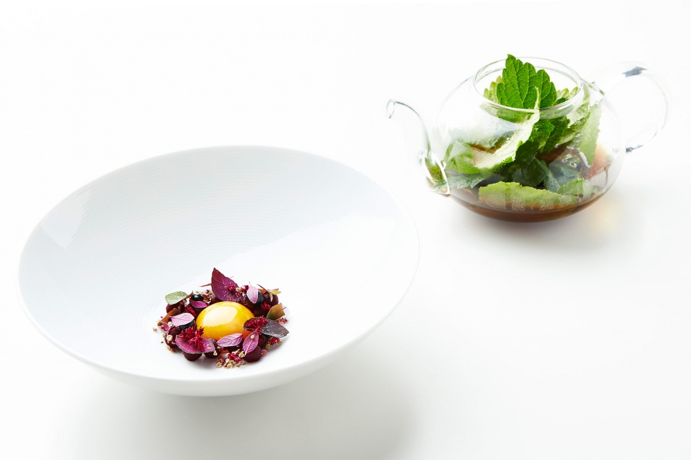 Biodynamic egg yolk in melted pork fat with pickled beets and infusion of black currant leaves (Credit: Claes Bech Poulsen)